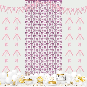 Purple sequin bow fringe curtain and pink satin bows for birthday party decorations