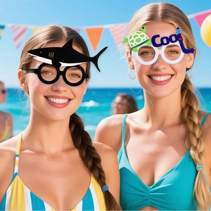 Kids ocean party glasses featuring black shark and white turtle designs in beach setting