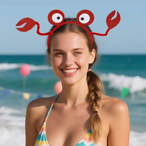 Détail d'un serre-tête crabe rouge à paillettes pour fête d'enfants sur la plage