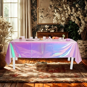 Detail of holographic iridescent tablecloth with vibrant rainbow metallic reflection