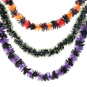 Close-up of thick Halloween tinsel garlands in orange, green, and purple festive colors