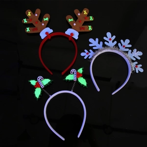 Detailed flat lay of Christmas headbands with felt reindeer antlers and snowflake designs