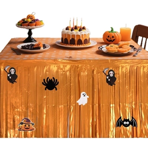 Orange metallic fringe Halloween table skirt with ghost and pumpkin decals for party decor