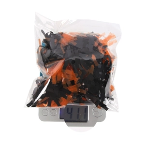 Detail showing weight measurement of orange and black Halloween tinsel garland decoration