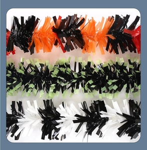 Close-up of tinsel garlands in black-orange, black-green, and black-white color schemes