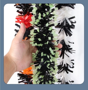 Close-up of fluffy multi-color Halloween tinsel garland for party decorations