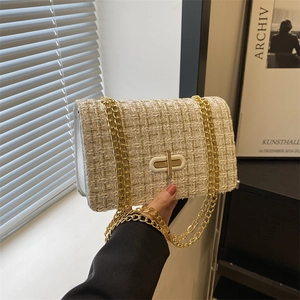 Retro tweed shoulder bag in beige and gold with a metallic chain strap and twist lock