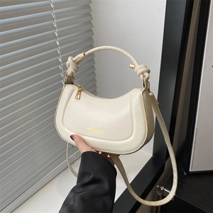 Creamy white semi-moon PU leather crossbody bag with knot handle and gold zipper