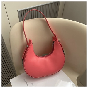 Close-up of coral pink hobo bag with smooth PU leather finish and metal zipper closure