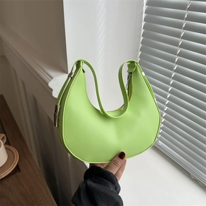 Neon green crescent saddle bag with smooth PU leather and silver metal buckles
