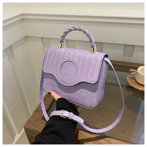 Lilac crocodile pattern mini handbag with woven top handle and gold hardware details