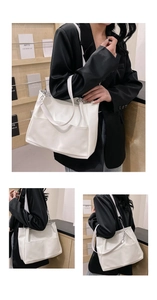 Detail view of white soft PU leather tote bag with wide strap and metallic chain links
