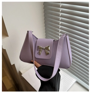 Close-up of lavender baguette bag with a polished silver mirror metal bow buckle