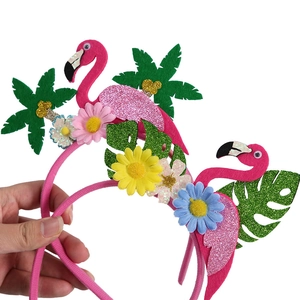 Pink flamingo party headband with glitter palm leaves and daisy flowers for beach theme