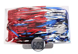 Detail shot of tricolor metallic fringe foil weighing 60.9g on a scale for party decor