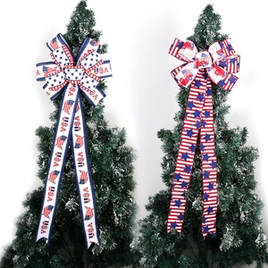 Detail of USA Independence Day bows featuring stars and stripes on green tree tops