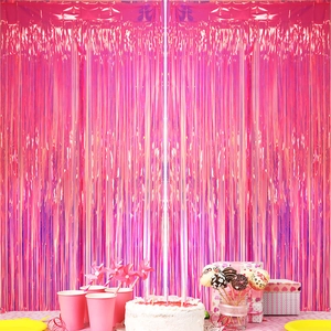 Rose pink iridescent foil fringe curtain backdrop with reflective metallic party decor