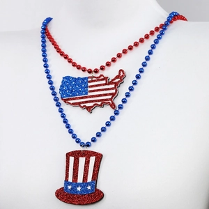 Detail view of Independence Day bead necklaces with glittery US flag and Uncle Sam hat pendants