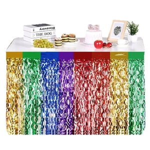 Rainbow foil fringe table skirt with metallic wave streamers for birthday party decor