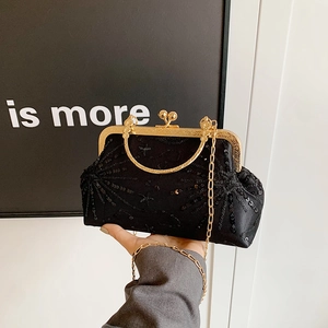 Elegante borsa da sera nera con paillettes, catena dorata e manico