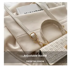 Detail of adjustable metal buckle and woven texture on beige small square bag