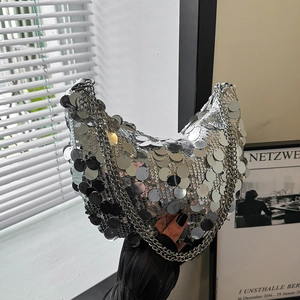 Silver sequin shoulder bag with metal chain strap and rounded crescent shape for parties