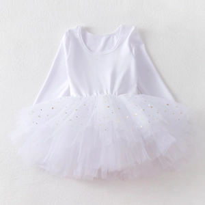 Close-up of white long sleeve ballet dress with gold star and moon foil tutu tulle details