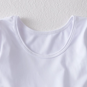 Close-up of white U-neck leotard neckline with durable double-needle stitching detail