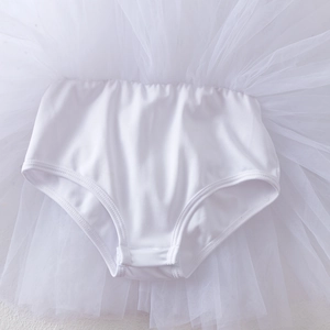 Detail of baby white long-sleeved ballet tutu dress with convenient bottom snap closure
