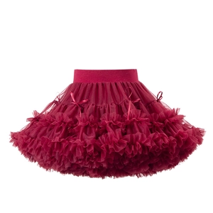 Detailed view of multilayer wine red tutu skirt with delicate satin bow and mesh layers