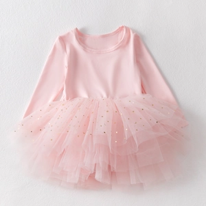 Detail of pink long sleeve tutu dress with gold sequin stars and moon on mesh skirt