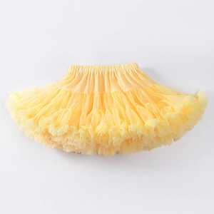 Close-up of bright yellow tutu skirt with layered mesh fabric and elastic waistband