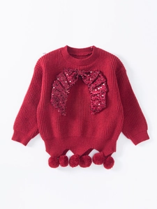 Kids red knit sweater with sequin trim and pom-poms for Lunar New Year celebration
