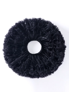 Flat lay of black layered tulle tutu skirt with elastic waistband and ruffled edges