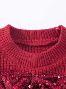 Red knit sweater for girls with round ribbed neckline and festive sequin detailing