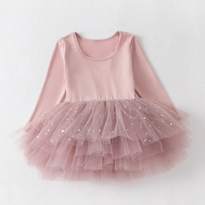 Close-up of pink long sleeve ballet tutu dress with golden star and moon sequins
