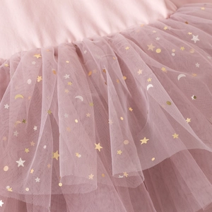 Detail showing layers of mauve tulle with golden star and moon sequins on a tutu dress