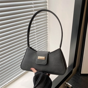 Classic black PU leather baguette bag with a gold metal clasp and minimalist strap