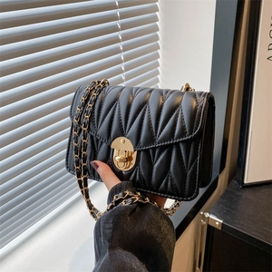 Elegant black quilted chain bag with gold hardware and classic pleated texture