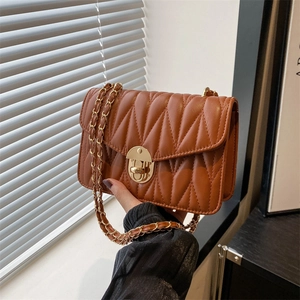 Brown quilted chain shoulder bag with gold hardware and stylish pleated leather design