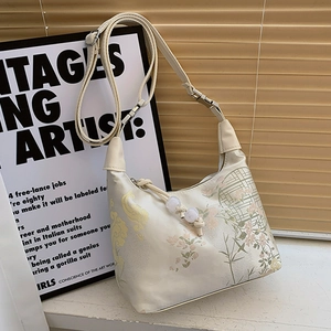 Elegant off-white jacquard shoulder bag with floral embroidery and adjustable strap