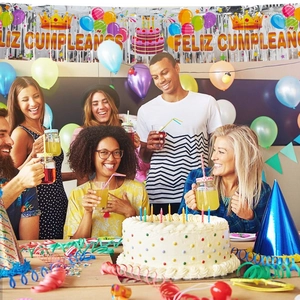 Spanish Feliz Cumpleaños banner set with fringe curtains and festive balloons décor