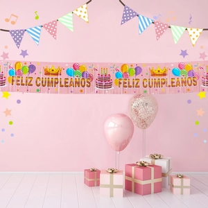 Pink Feliz Cumpleaños birthday banner with balloons and crown party decorations