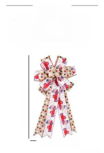 Detail view of burlap Independence Day bow with stars, stripes, and red truck patterns