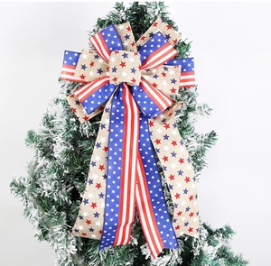 Close-up of patriotic American flag bow decoration with stars and stripes on a tree