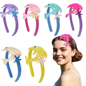 Colorful sequin dolphin and starfish headbands for ocean themed kids birthday parties