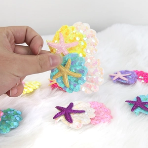 Starfish and seashell hair clips with colorful glitter sequins for ocean themed parties