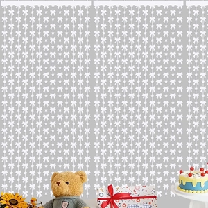 White bow and star tassel curtain decoration for festive party backdrop arrangements