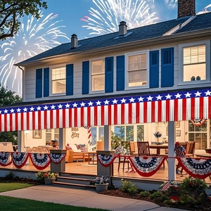 Outdoor July 4th decor featuring red white and blue fringe banners on a porch with fireworks