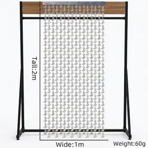 Laser foil fringe curtain with cowboy boot shapes measuring 2 meters tall and 1 meter wide